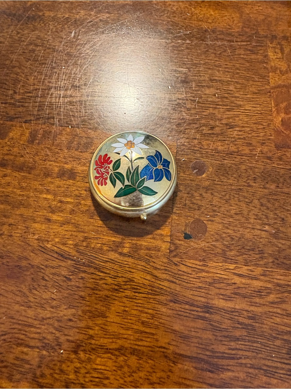 Vintage Swiss pill box with floral enamel